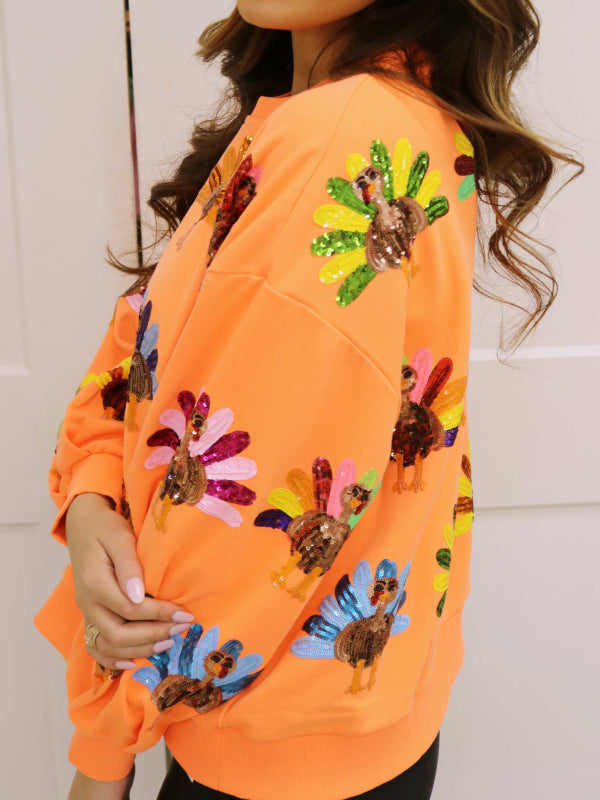 Sudadera con lentejuelas de pavo de color naranja neón 